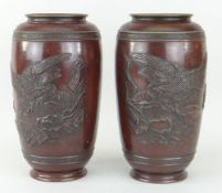 PAIR OF ORIENTAL GONGS BALUSTER VASES, both with relief decoration of perched eagle within a