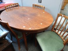 OVAL LIGHT OAK DINING TABLE together with four rail back cushioned chairs