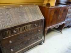 CARVED DARK OAK DROP DOWN BUREAU together with reproduction mahogany effect drinks / cocktail