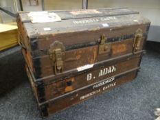 A VINTAGE DOME TOP WOODEN BANDED CANVAS STEAMER TRUNK with travel stickers for the ship SS