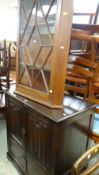 DARK OAK LINEN FOLD-STYLE ENTERTAINMENT CABINET together with a astragal glazed hanging corner