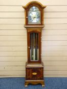 A MODERN TEMPUS FUGIT TRIPLE BRASS WEIGHT, DARK WOOD ENCASED GRANDMOTHER CLOCK with domed hood,