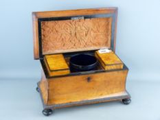 A VICTORIAN SATIN WOOD TEA CADDY with ebonized detail and bun feet, waisted sarcophagus form with