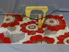 A MODERN WOODEN BASED HEAVY GLASS TOPPED DESIGNER STYLE COFFEE TABLE and a floral modern rug