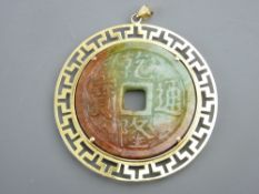 A FINE LARGE CIRCULAR ORIENTAL JADEITE PENDANT with Chinese motifs, mounted by a fine 14ct gold '