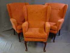 A PARCEL OF THREE MATCHING UPHOLSTERED WING BACK CHAIRS