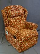 A DARK AND FLORAL UPHOLSTERED MANUAL RECLINING CHAIR