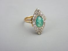 AN 18CT GOLD DIAMOND & EMERALD DRESS RING, the pear shaped cluster having an oval centre emerald