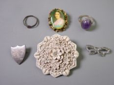 A SMALL PARCEL OF MIXED JEWELLERY including a bone or composition floral brooch, a silver ring, a