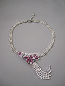 AN ATTRACTIVE CZ & PINK STONE TASSELLED NECKLACE, the chain having a double strand of cubic