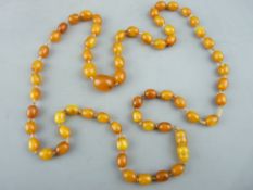 A BALTIC AMBER NECKLACE of graduated oval beads, 80cms long, 24.5gms