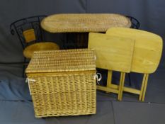 A WICKER WROUGHT IRON TABLE AND TWO CHAIRS, a woven storage basket and two light wood folding