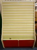 A MULTI SECTION CARD/LEAFLET DISPLAY CABINET with twin base drawers