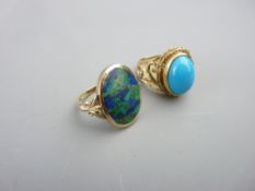 A 9CT GOLD DRESS RING with oval turquoise stone, 7gms, size P and a 9ct gold dress ring with mottled