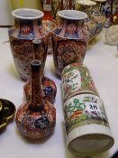 AN EARLY 19TH CENTURY CHINESE CANTON DECORATED TANKARD (damage), a pair of facet bottle vases and