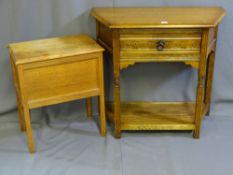 A HALL TABLE WITH SHAPED TOP, single drawer with carving and lower base shelf and a small light oak,