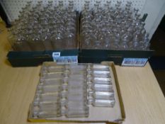 A LARGE COLLECTION OF CLEAR GLASS VINTAGE CHEMIST DISPENSARY BOTTLES namely with ribbed front