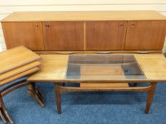 A GLASS TOPPED G PLAN LONG JOHN COFFEE TABLE, a mid century teak effect sideboard and G Plan style