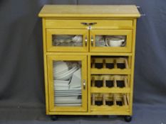 A MODERN KITCHEN STORAGE UNIT and contents of white modern crockery