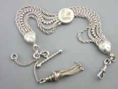 A BELIEVED SILVER ALBERT CHAIN of five silver rows, with two heart shaped links, a centre floral