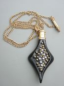 A FINE LARGE JET STYLE GOLD MOUNTED SHAPED PENDANT with tiny diamonds (eight) and gold balls