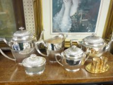 A FIVE PIECE EPNS RIB PATTERNED TEA SERVICE and a three piece modern brass cruet set