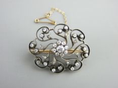 A VICTORIAN DIAMOND SET OPEN WORK BROOCH, untested but believed gold on silver with screw off hat