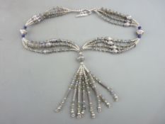 A SILVER & GLASS BEAD NECKLACE of four quadruple strands with fine silver links and an eight