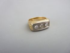 A GOLD DIAMOND DRESS RING with three centre diamonds in an oblong setting, each of visual estimate