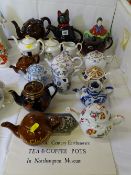 A COLLECTION OF VINTAGE AND LATER TEA POTS - including a hand painted Herend example, a Copeland