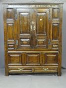 A LATE 17TH CENTURY BULK LIVERY CUPBOARD with a narrow date band to the top, 1699MM and two