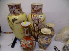 A LARGE PAIR OF VICTORIAN SATSUMA VASES, a smaller pair of baluster vases along with a circa 1900