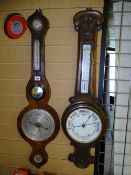 A GEORGIAN BANJO BAROMETER (for restoration) and a Victorian carved oak barometer with thermometer