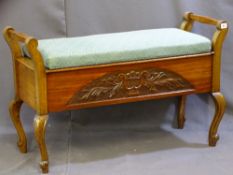 A FLORAL UPHOLSTERED AND STUDDED DUET PIANO STOOL on shaped supports and carved front detailing