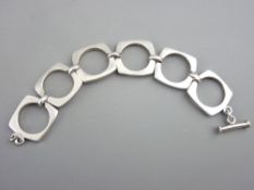 A BELIEVED SILVER BRACELET of six square links, 57.5gms