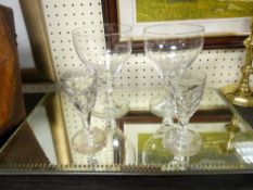 TWO PAIRS OF EARLY 19TH CENTURY DRINKING GLASSES with an antique mirrored display tray
