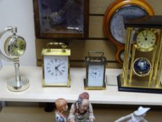 A MATTHEW NORMAN LONDON BRASS CARRIAGE CLOCK and three further modern mantle clocks