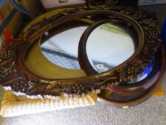 A VINTAGE OVAL WALL MIRROR, a selection of modern mirrors along with a grape and vine effect