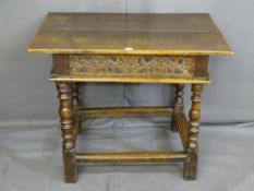 AN 18TH CENTURY OAK SIDE TABLE with an overhanging top to a narrow drawer with carved and scrolled
