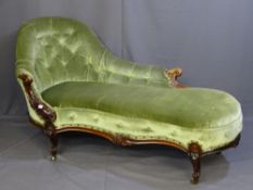 A VICTORIAN WALNUT CHAISE LONGUE (some fading) with shaped back in button draylon upholstery,