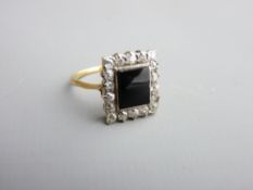 AN UNMARKED DRESS RING of dark blue centre stone with eighteen tiny surrounding diamonds, each of