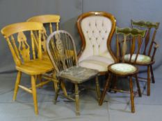 A REPRODUCTION BUTTON BACK UPHOLSTERED CHAIR, circular seated velour and brass stud upholstered