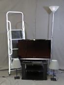 A PANASONIC VIERA LCD TV AND STAND, two black metal and grey shaded table lamps, a metal effect