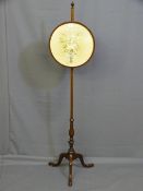 A NEAT MAHOGANY TRIPOD PULL SCREEN with circular floral silk panel and carving to the column base on