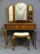 A MID CENTURY MAHOGANY CONCAVE FRONT DRESSING TABLE with triple mirror on tapered legs with pad feet
