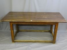 A PINE REFECTORY TABLE, on square corner supports with narrow turn stretchers, 77cms height,