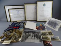 A COLLECTION OF MILITARY CAP BADGES, buttons and embroidered tunic emblems with a quantity of framed