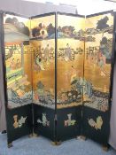 A VINTAGE JAPANESE FOUR-FOLD DRESSING SCREEN, typical colourful decoration relief with a gilt