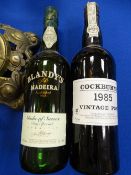 A 1985 BOTTLE OF COCKBURN'S VINTAGE PORT and a bottle of Blandy's Madeira