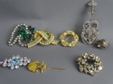 SEVEN ATTRACTIVE PIECES OF DRESS JEWELLERY, the majority decorated with pearls and CZs ETC